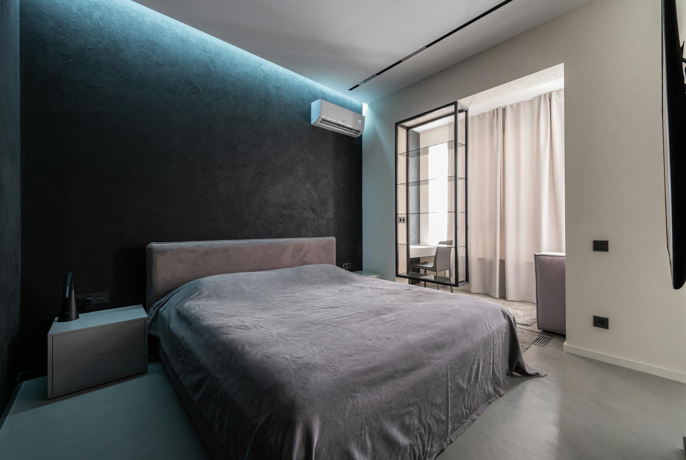 Modern bedroom with wall mounted air conditioning